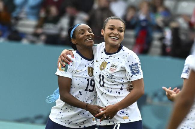 The United States’ Sophia Smith, right, celebrates with Crystal Dunn after scoring her team’s goal during the Women’s World Cup game against Vietnam at Eden Park in Auckland, New Zealand, Saturday, July 22, 2023. (Andrew Cornaga / ASSOCIATED PRESS)
