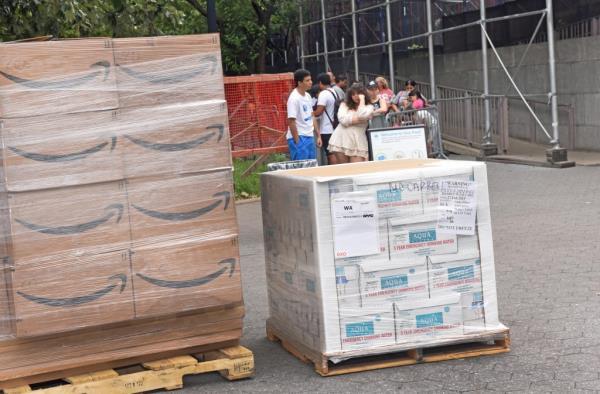 Migrants stand on line at the Roosevelt Hotel.
