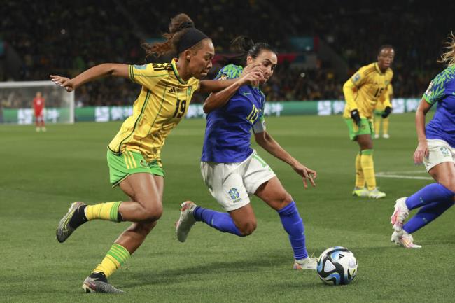 Brazil's Marta, right, compete for controls the ball with Jamaica's Tiernny Wiltshire during the Women's World Cup Group F soccer match between Jamaica and Brazil in Melbourne, Australia, Wednesday, Aug. 2, 2023. (AP Photo/Hamish Blair)