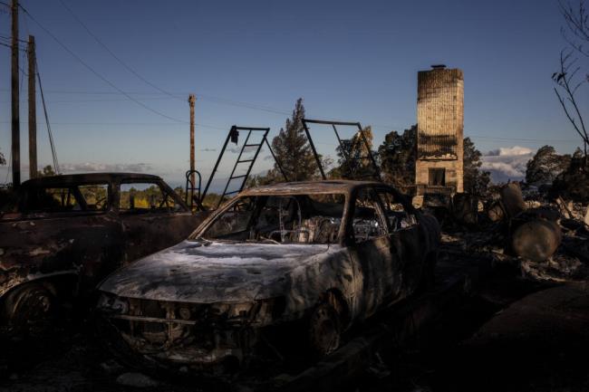 Vehicles and a home destroyed by a wildfire in Kula, Maui, Hawaii, Aug. 14, 2023. (Bryan Anselm/The New York Times)