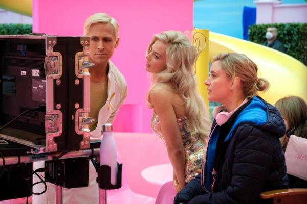 Actors Ryan Gosling and Margot Robbie with director Greta Gerwig on the set of