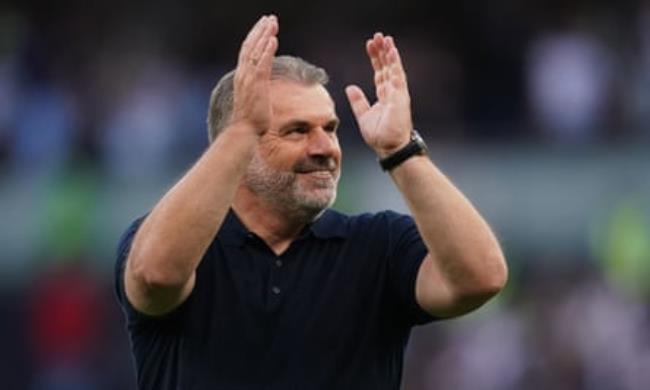 Ange Postecoglou applauds the fans after the final whistle.