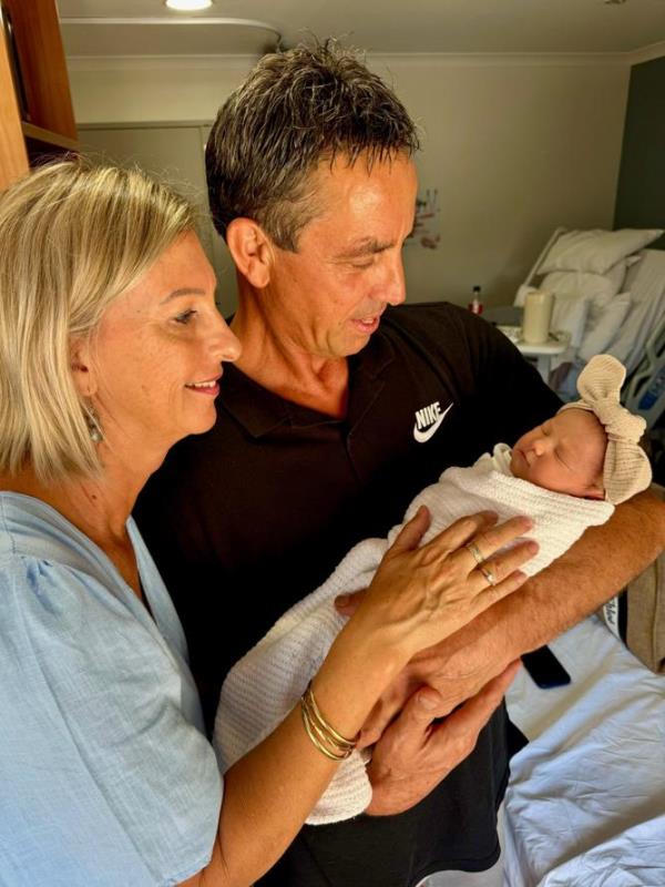 Brittany Bown's parents, Jacque and Chris, with Zuri Ateca Naitanui.