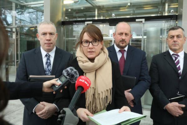 Garda liason officer Martina Walsh makes a statement on behalf of the victims' family in relation to the life in prison handed down to