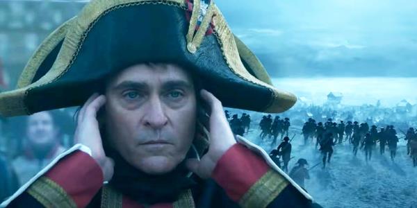 Custom image of Joaquin Phoenix as Napoleon juxtaposed with a wave of soldiers running into battle in a snowy landscape.