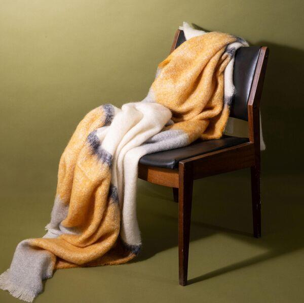  The Silare ochre mohair throw from The Irish Design Shop is made by Cushendale (245).