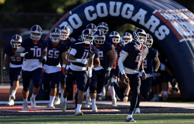 The Rancho Cotate Cougars take the field for their gridiron tilt against the Petaluma High school Trojans, Friday Aug, 25, 2023 at Santa Rosa Junior College. (Kent Porter / The Press Democrat)