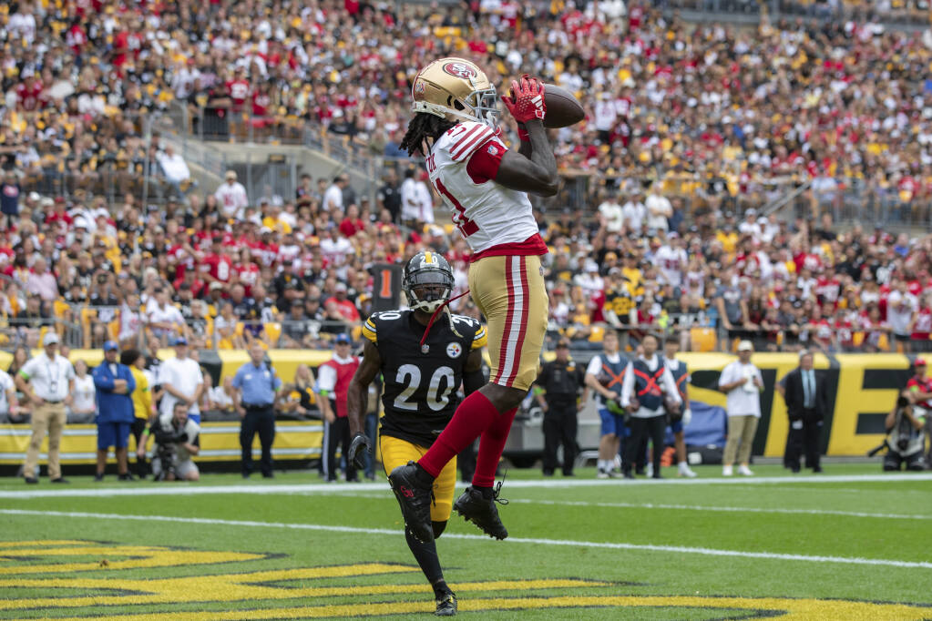49ers wide receiver Brandon Aiyuk catches a touchdown pass during Sunday’s game in Pittsburgh. (Matt Durisko / ASSOCIATED PRESS)
