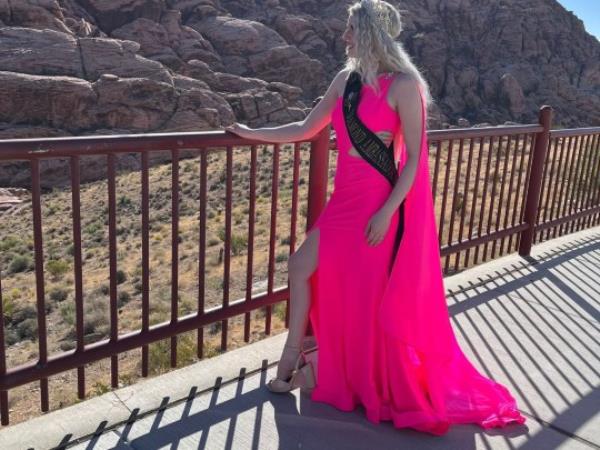 Jessica in the desert in a pink dress